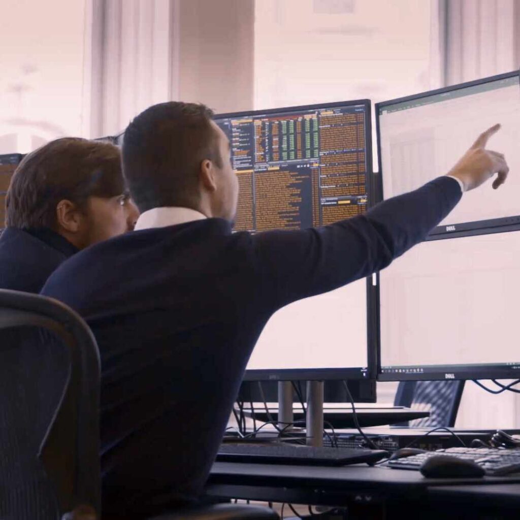 pointing up at financial screen